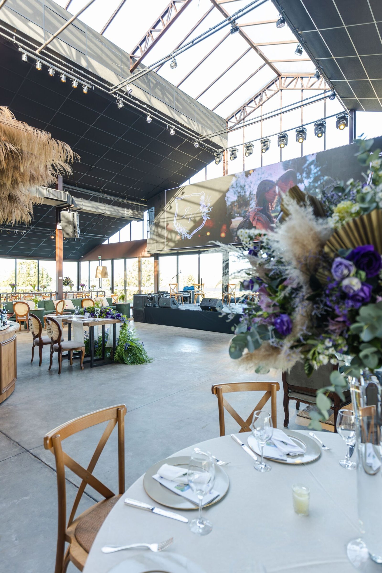 Elegant luxury banquet hall decorated for a reception with chandeliers and floral centerpieces
