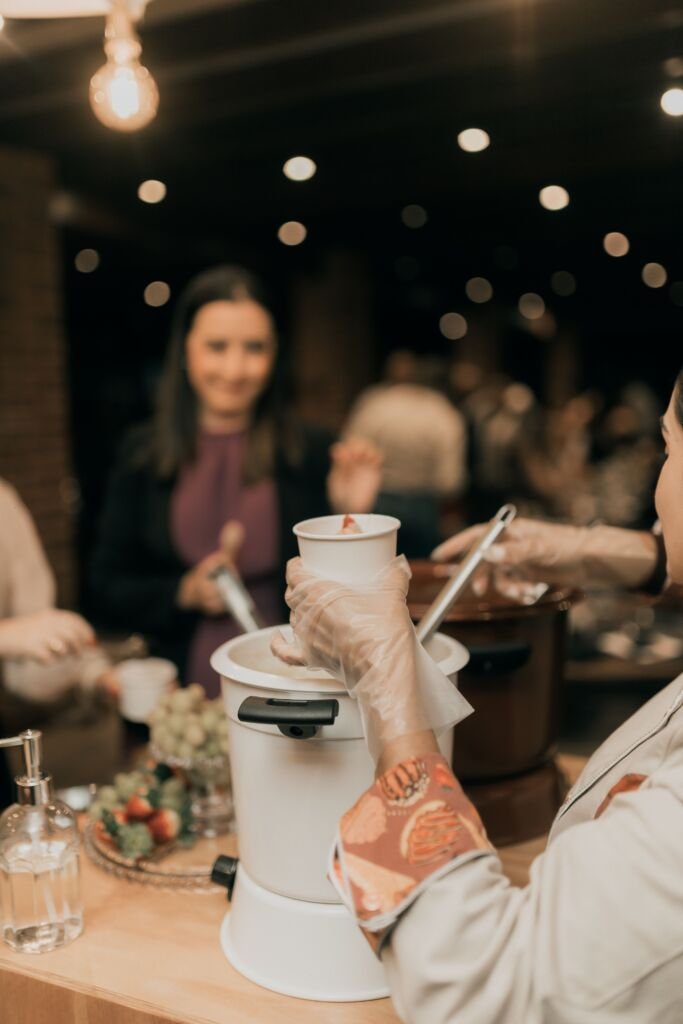 Catering staff serving food at a corporate indoor event