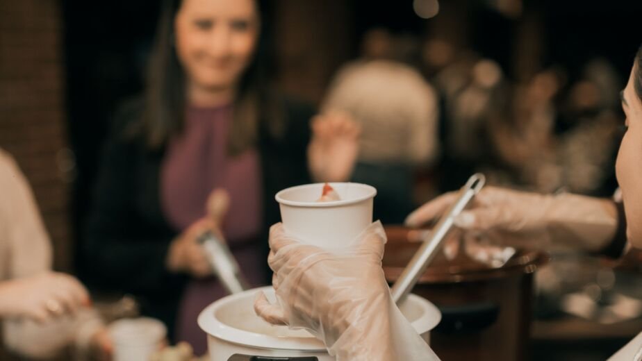 Catering staff serving food at a corporate indoor event